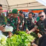 Letkol Inf Fahmil Haris, S.IP, Komandan Kodim 1303 Bolmong saat mendatangi salah satu penjual sayur di area Kegiata Bakti Soaial