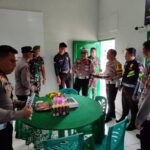 Personel TNI dan Polri berfoto bersama di Kipan C Yonif 713/Satya Tama, Kotamobagu Utara. Sumber: Humas Polres Kotamobagu