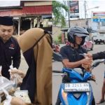 Anggota DPRD Boltim, Rahman Salehe (tengah), mengenakan peci hitam, menyerahkan paket takjil kepada seorang wanita berhijab di Kecamatan Kotabunan, Sabtu (14/3/2026). Aksi sosial yang dipimpinnya bersama DPC PDI Perjuangan Boltim ini membagikan 1.500 paket takjil gratis kepada warga sebagai bentuk kepedulian di bulan Ramadan. (Foto: Dok. Istimewa)