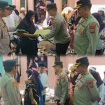 Kapolres Boltim, AKBP Golfrie Hasiholan bersama jajaran menyerahkan bantuan dan memberikan dukungan moral kepada keluarga korban KDRT di Desa Buyat I, Kotabunan, Senin (13/04/2026).