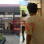 Oknum Anggota DPRD Kotamobagu berinisial HMAK (tengah) saat mendatangi Unit III Tipidter Polres Kotamobagu untuk menjalani pemeriksaan, Senin (11/5/2026).
