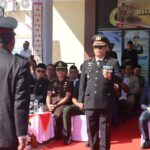 Kapolres Boltim AKBP Golfried Hasiholan Pakpahan, S.H., M.Si. saat memimpin jalannya upacara peringatan Hari Bhayangkara ke-80 di Lapangan Apel Polres Boltim, Tutuyan, Rabu (1/7/2026).