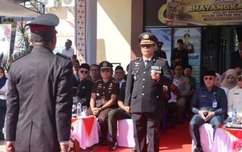 Pimpin Upacara Ke-80, Kapolres Boltim Perkuat Sinergi Forkopimda 3 Kapolres Boltim AKBP Golfried Hasiholan Pakpahan, S.H., M.Si. saat memimpin jalannya upacara peringatan Hari Bhayangkara ke-80 di Lapangan Apel Polres Boltim, Tutuyan, Rabu (1/7/2026).