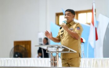 Gubernur Yulius Sebut GMIBM Mitra Strategis Pemprov Sulut 3 Gubernur Yulius Selvanus, memberikan sambutan dalam Ibadah Pembukaan Sidang Sinode ke-60 GMIBM di Kabupaten Bolaang Mongondow, Senin, 13 Juli 2026.