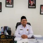 Kepala BPN Boltim, Chandra Husain memberikan penjelasan mengenai prosedur pengukuran dan penetapan hak atas lahan di Desa Lanut.